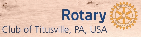 Logo of Titusville Rotary Club with Wood background.